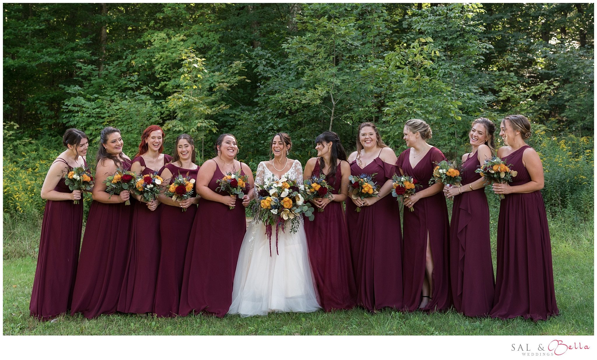 Bridesmaids laughing as they pose for wedding photos