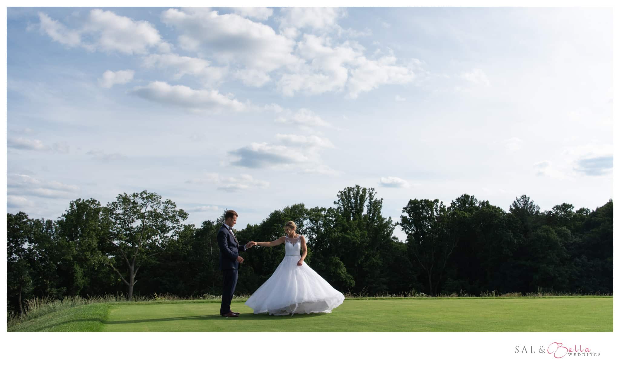 newlyweds dance on the green at Shannopin Country Club