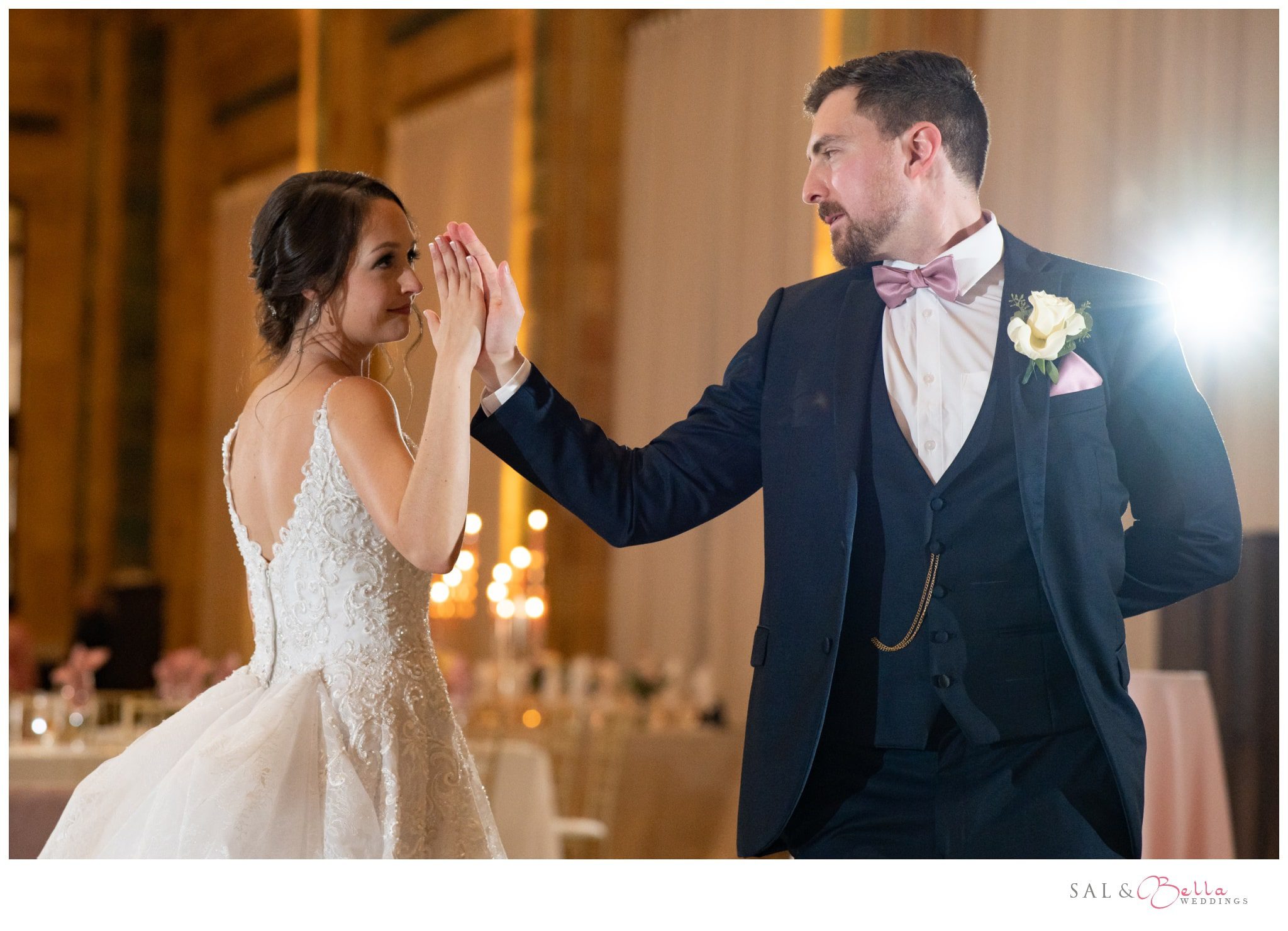 bride & groom share in a choreographed first dance palm to palm at the Pennsylvanian. 