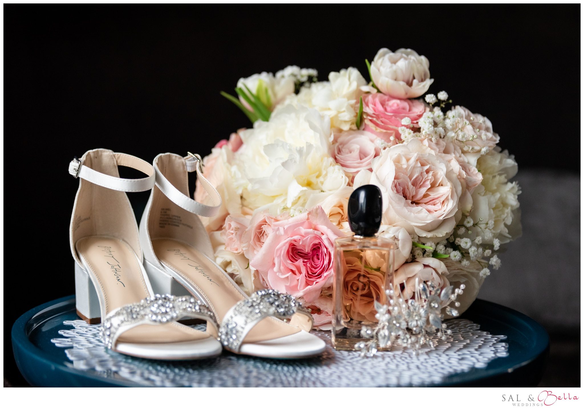 Bride's wedding details laying on a table at the Renaissance hotel