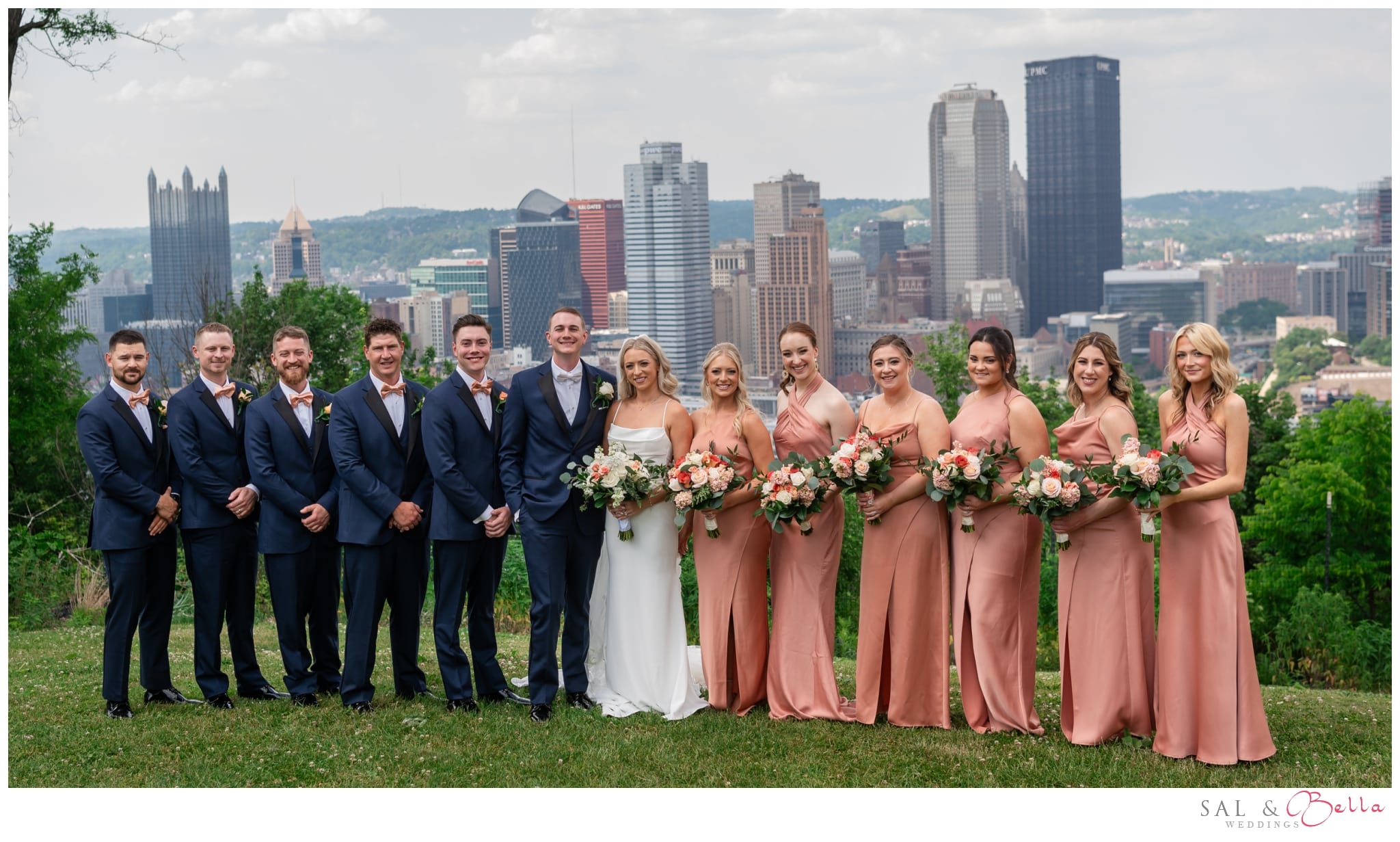 bridal party poses on mt. washington for wedding photos