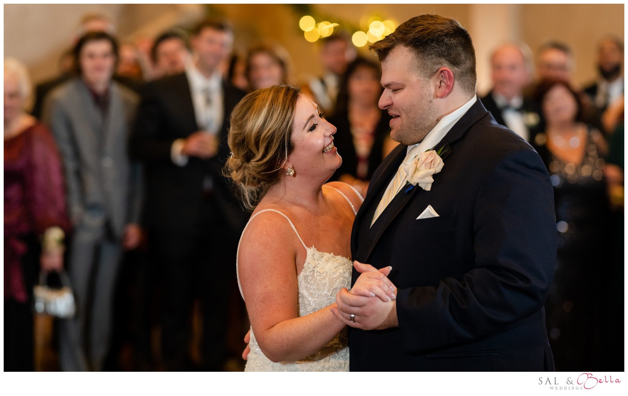 bride and groom share a dance together in front of all their guests at Bella Sera in Canonsburg