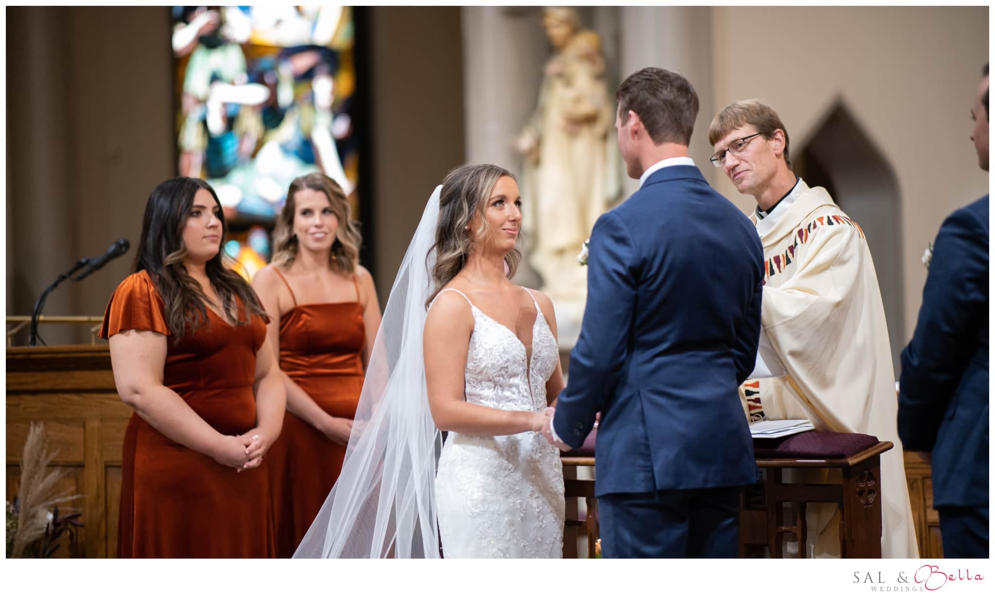 wedding couple exchanges their vows at st. mary on the mount in pittsburgh