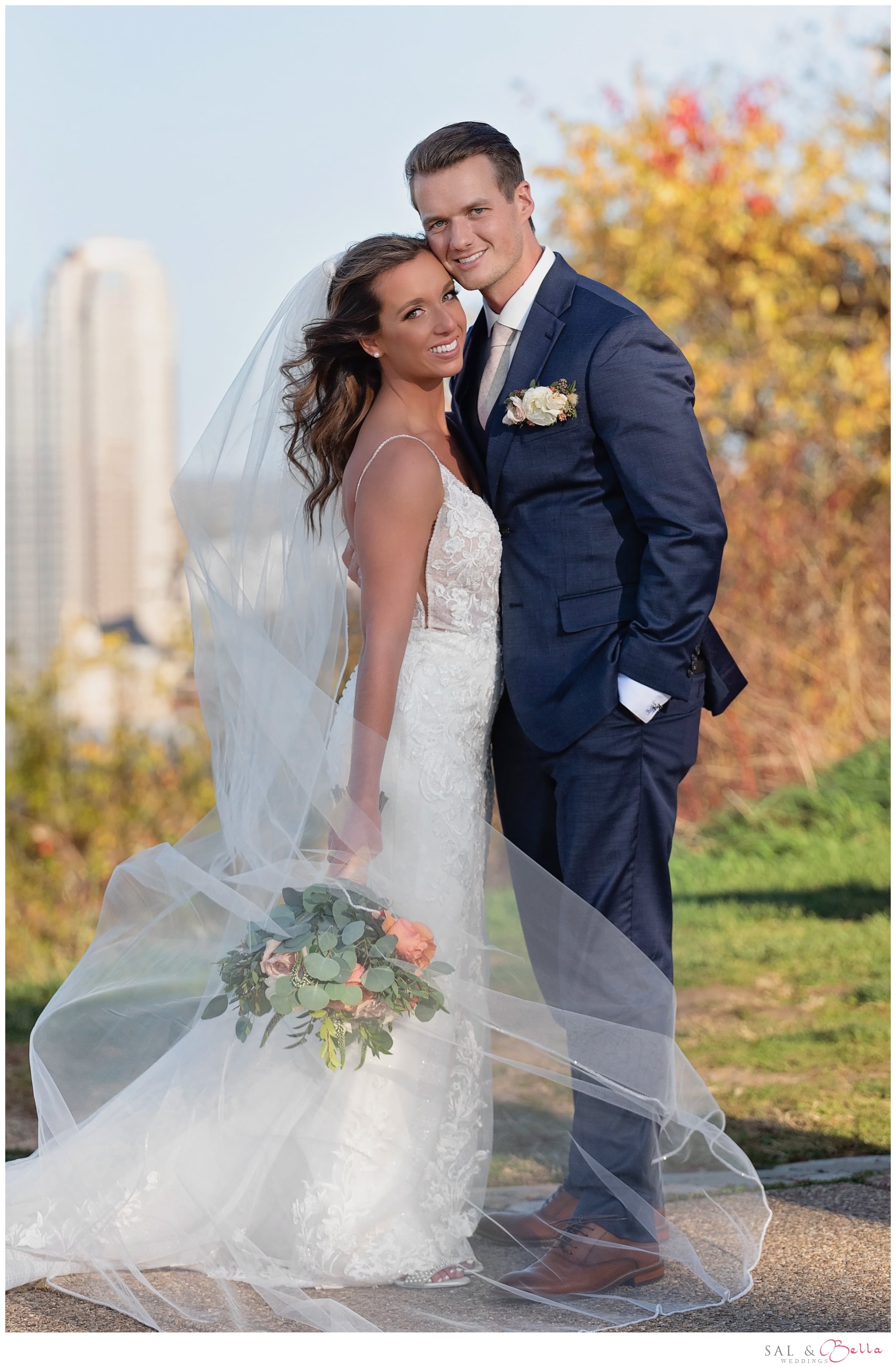 couple smiles and poses for a beautiful portrait on mt Washington in Pittsburgh.