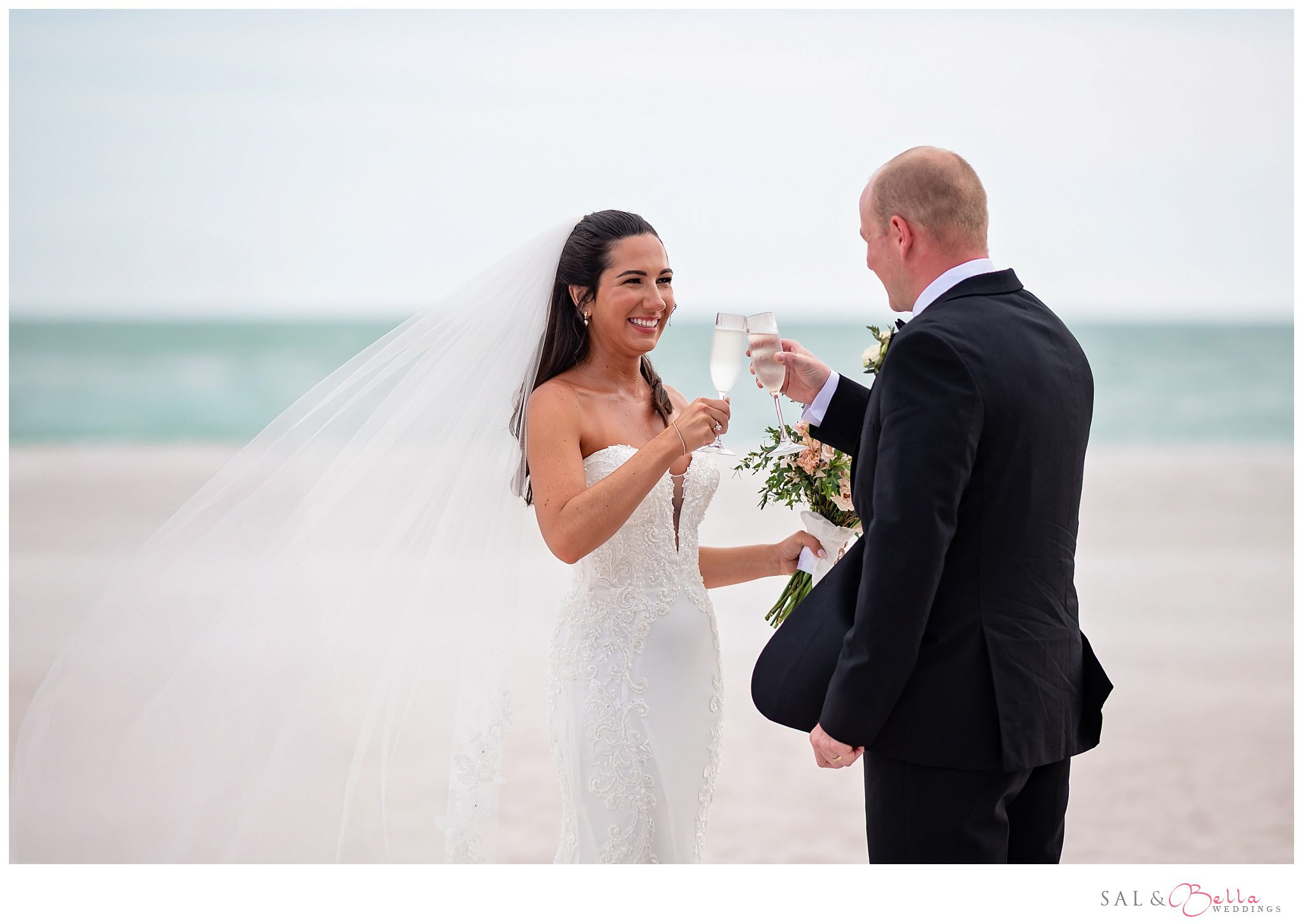 Couple celebrating with champagne after their wedding ceremony at The Resort at Longboat Key Club.