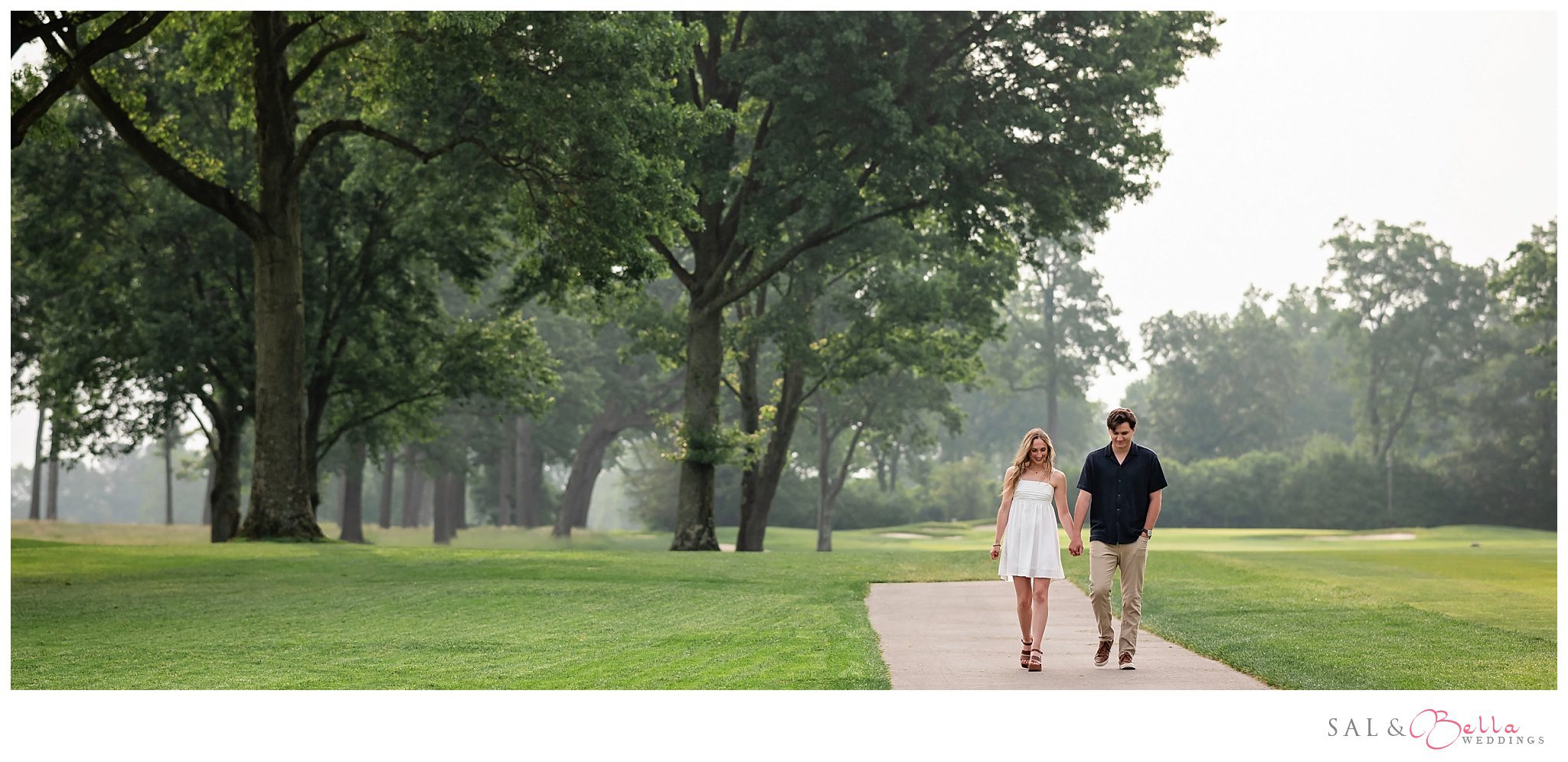 Camille and Brennan walking across the green at Butler Country Club during their engagement session.