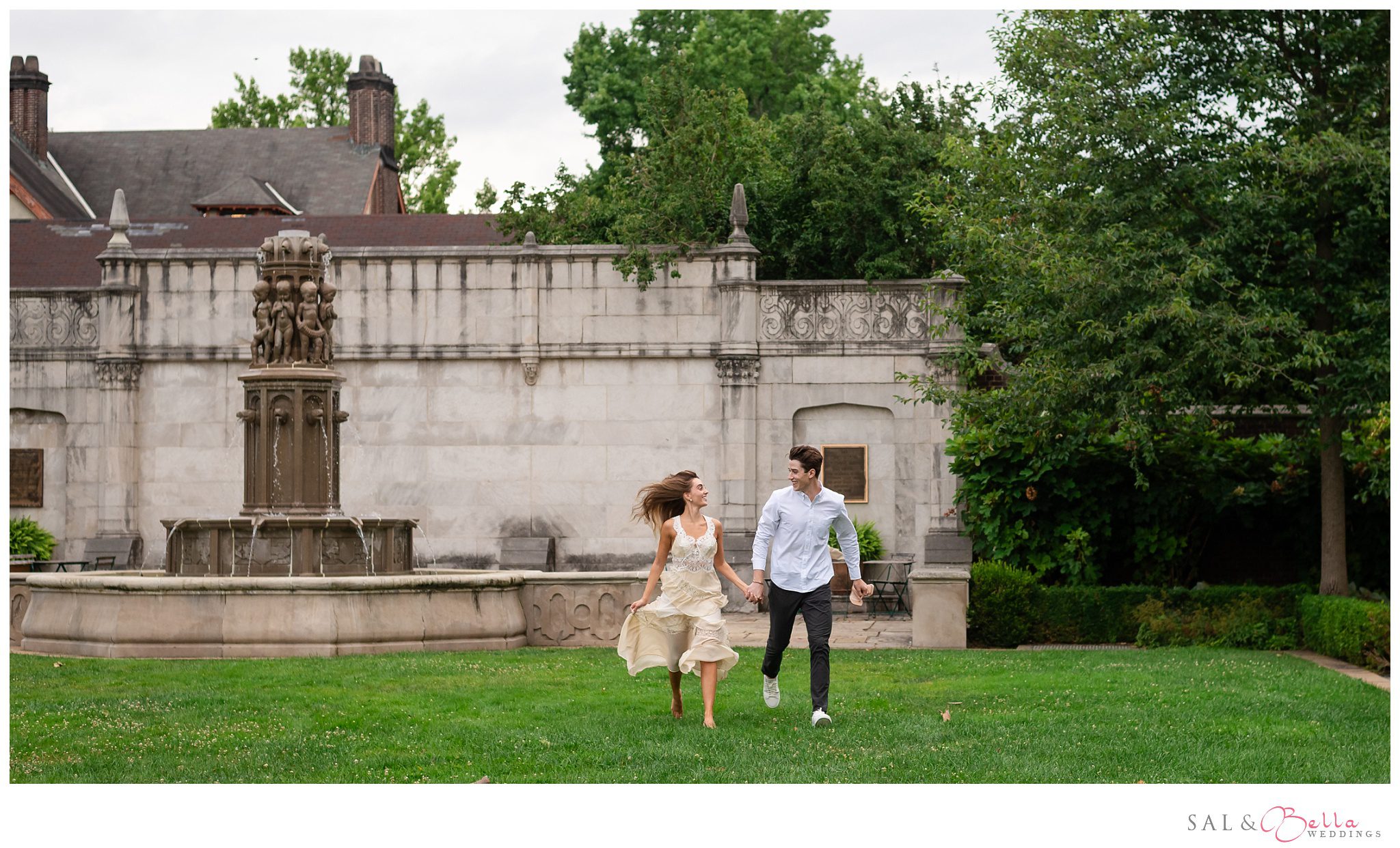 couple playfully running hand in hand during their engagement session at Mellon Park in Pittsburgh. 