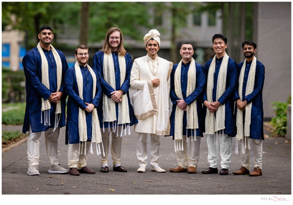 Groom & his groomsmen pose for portraits in their traditional indian outfits. 