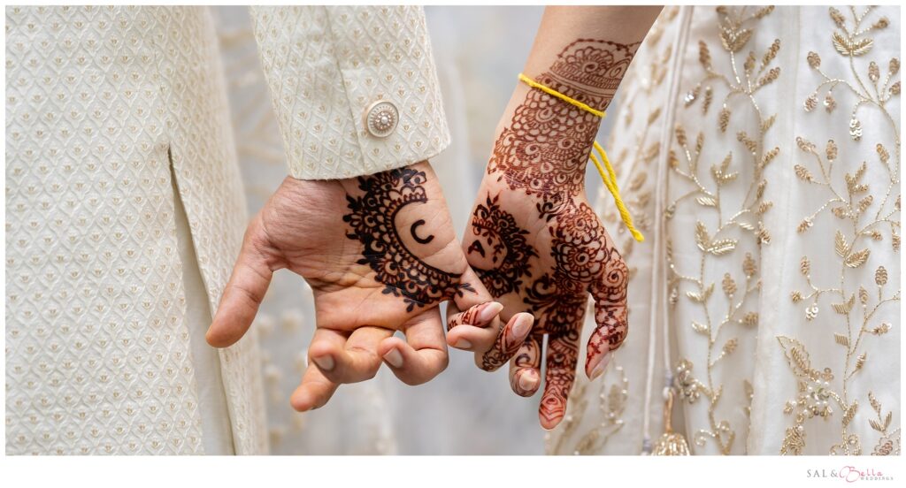 bride & groom's hands featuring their mehndi 