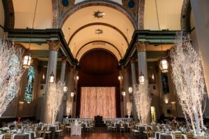 Wide view of the Grand Hall at the Priory in Pittsburgh's North Side Neighborhood. It showcases the twinkling string lights.