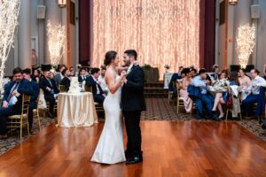 The couple dances blissfully together for their first dance at the grand hall.