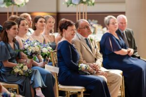 guests watch lovingly as the couple exchanges their vows.
