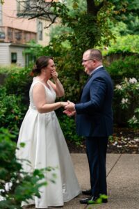 The couple shares a first look before their ceremony at the Priory.