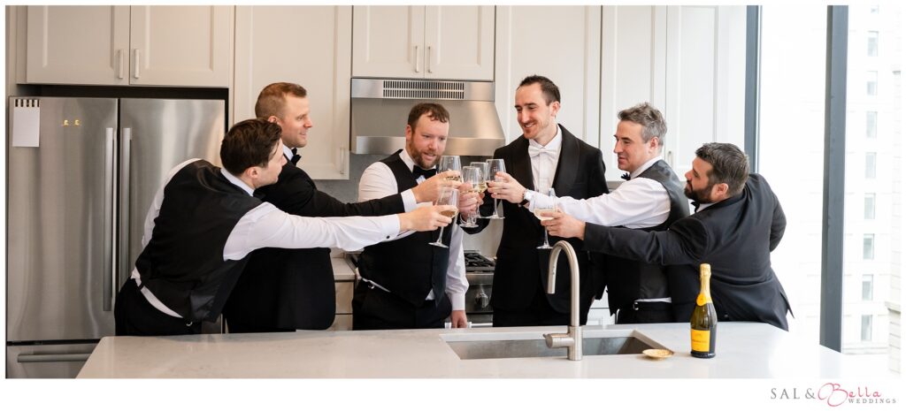 Mike and his groomsmen raising a toast together before his Pittsburgh wedding ceremony